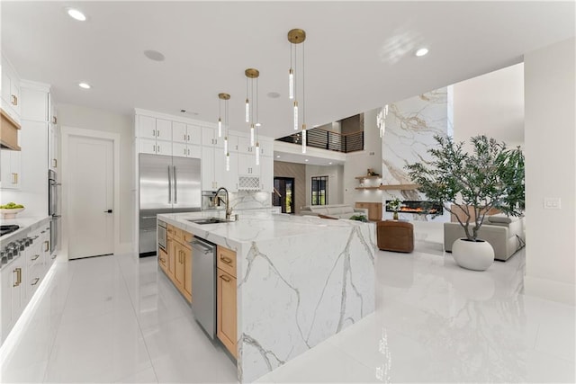 1336 Azalea Dr, Lawrenceville, GA 30043 - kitchen featuring appliances with stainless steel finishes, recessed lighting, a sink, light stone counters, and white cabinetry