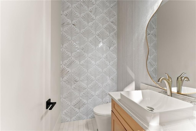 1336 Azalea Dr, Lawrenceville, GA 30043 - bathroom featuring vanity, toilet, and wallpapered walls
