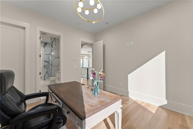 1336 Azalea Dr, Lawrenceville, GA 30043 - office space with light wood finished floors, baseboards, and a chandelier