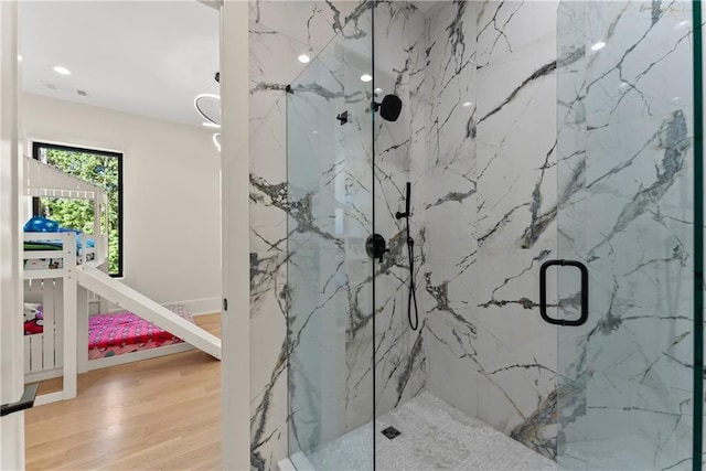 1336 Azalea Dr, Lawrenceville, GA 30043 - full bathroom featuring a marble finish shower, wood finished floors, and recessed lighting