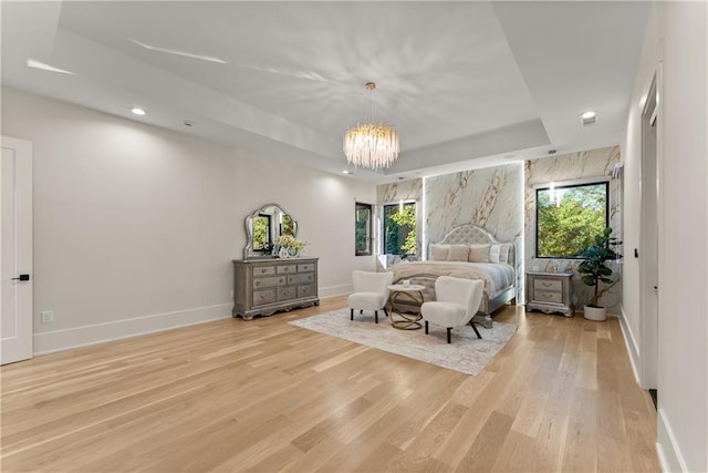 1336 Azalea Dr, Lawrenceville, GA 30043 - bedroom with light wood finished floors, multiple windows, a tray ceiling, baseboards, and recessed lighting