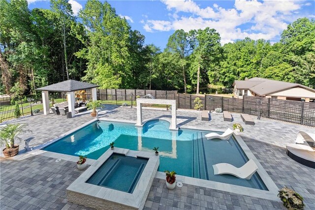 1336 Azalea Dr, Lawrenceville, GA 30043 - view of swimming pool with a gazebo, a patio, a fenced backyard, and a pool with connected hot tub