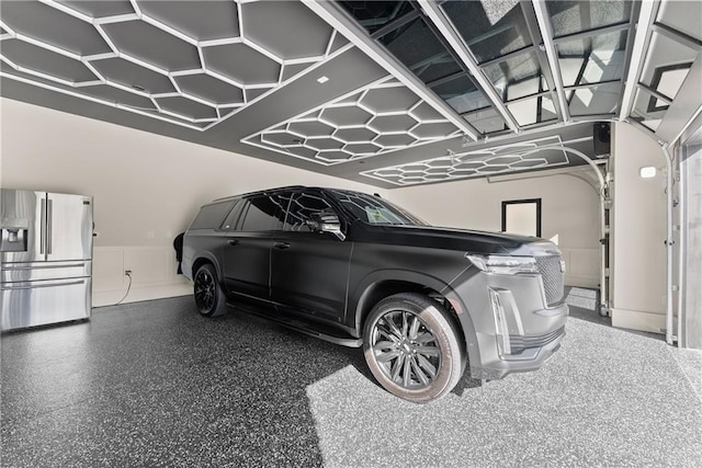 1336 Azalea Dr, Lawrenceville, GA 30043 - garage featuring stainless steel fridge with ice dispenser and wainscoting