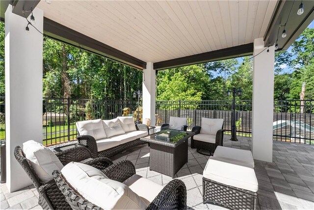 1336 Azalea Dr, Lawrenceville, GA 30043 - view of patio with an outdoor living space and view of wooded area