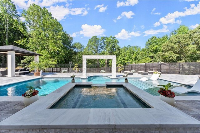 1336 Azalea Dr, Lawrenceville, GA 30043 - view of pool with a gazebo, outdoor lounge area, a patio, and a pool with connected hot tub