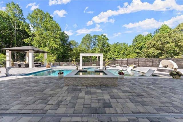 1336 Azalea Dr, Lawrenceville, GA 30043 - view of pool with a gazebo, a patio, an in-ground hot tub, and view of wooded area