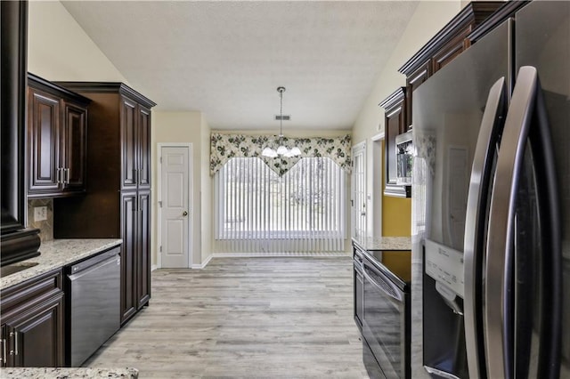 kitchen with dark brown cabinetry, light wood finished floors, a notable chandelier, and appliances with stainless steel finishes