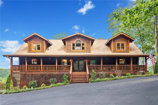 cabin featuring covered porch