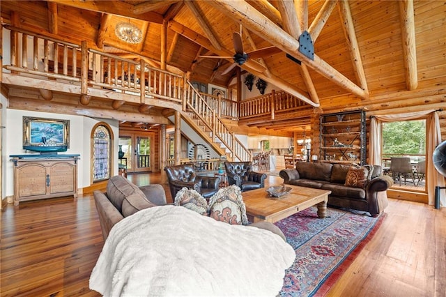 living room with high vaulted ceiling, wood ceiling, hardwood / wood-style floors, and beamed ceiling