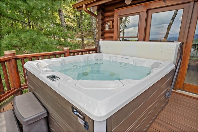 deck featuring a hot tub