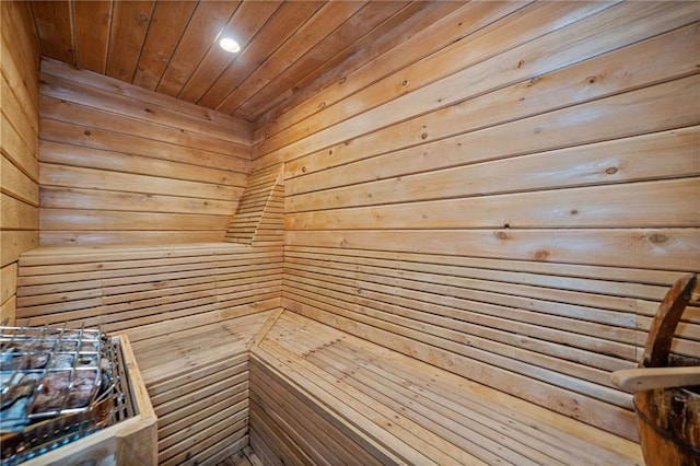 view of sauna / steam room with wood walls and wood ceiling