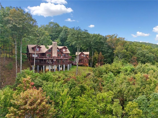 back of property with a wooden deck