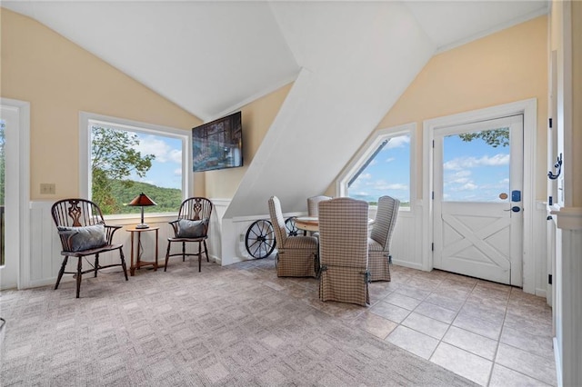 sitting room with light tile patterned flooring and lofted ceiling