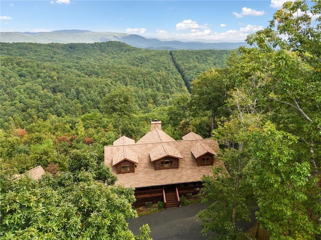 birds eye view of property featuring a mountain view