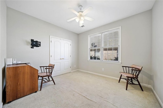 interior space featuring carpet flooring, visible vents, baseboards, and ceiling fan