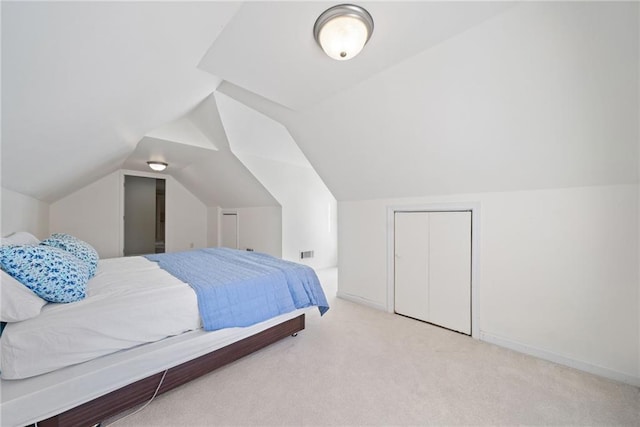 carpeted bedroom featuring visible vents, baseboards, and vaulted ceiling