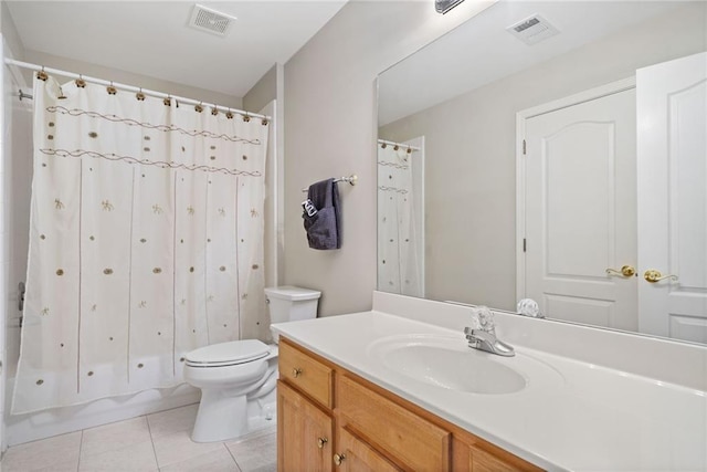 bathroom with tile patterned flooring, visible vents, toilet, and vanity