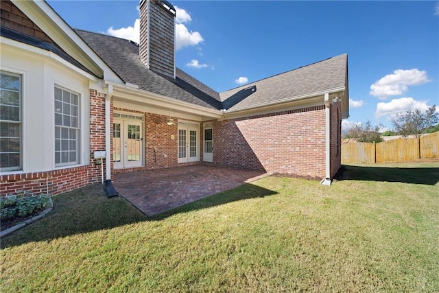 back of house with a patio, fence, french doors, a yard, and brick siding