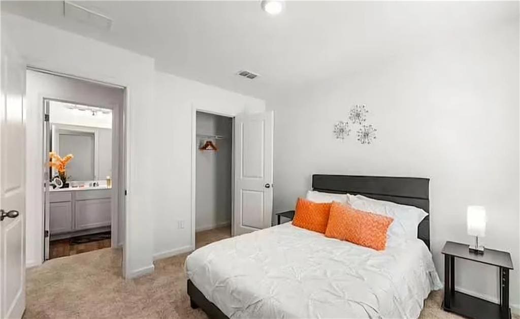 carpeted bedroom with a closet