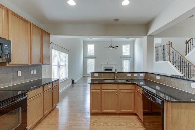 7719 Copper Kettle Way, Flowery Branch, GA 30542 - kitchen with black appliances, ceiling fan, light wood-type flooring, backsplash, and recessed lighting