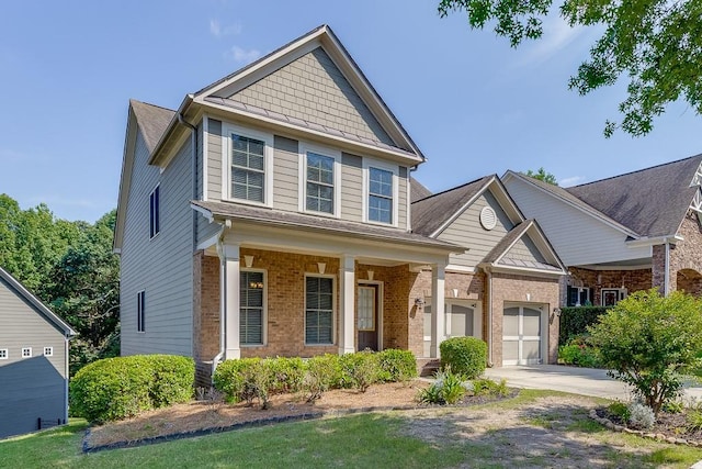 7719 Copper Kettle Way, Flowery Branch, GA 30542 - view of front of home featuring brick siding, concrete driveway, a garage, and a porch