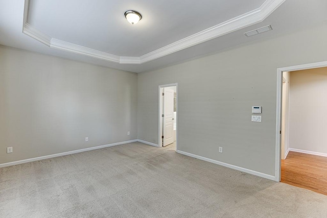 7719 Copper Kettle Way, Flowery Branch, GA 30542 - empty room with ornamental molding, a tray ceiling, and light colored carpet