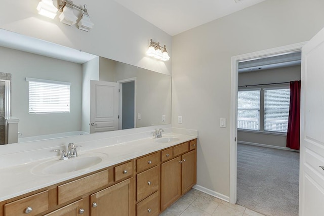7719 Copper Kettle Way, Flowery Branch, GA 30542 - full bathroom featuring double vanity, healthy amount of natural light, tile patterned flooring, and a shower with shower door