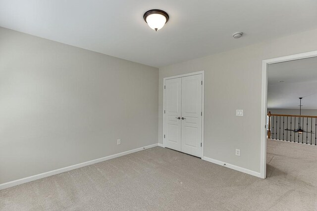 7719 Copper Kettle Way, Flowery Branch, GA 30542 - unfurnished bedroom featuring carpet floors and a closet