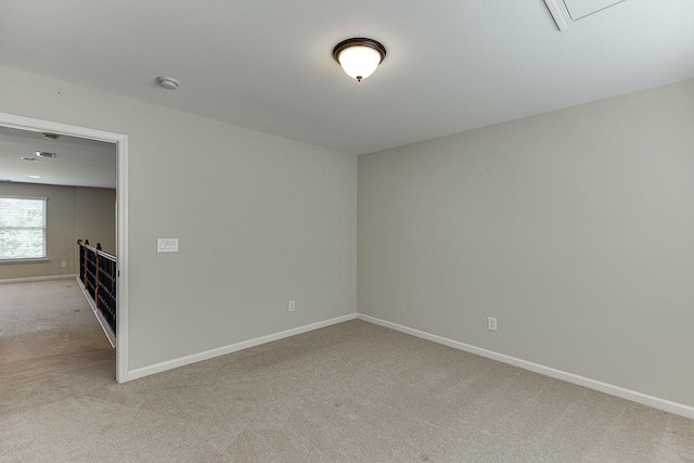 7719 Copper Kettle Way, Flowery Branch, GA 30542 - spare room featuring light colored carpet and a smoke detector