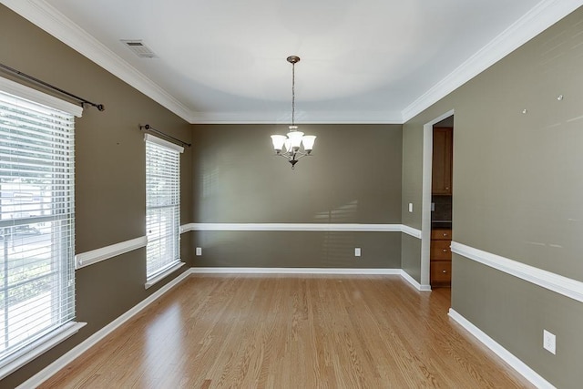 7719 Copper Kettle Way, Flowery Branch, GA 30542 - spare room with a chandelier, light wood finished floors, and crown molding