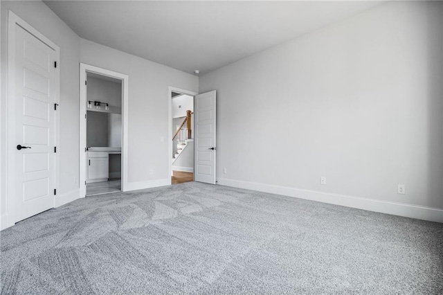 unfurnished bedroom featuring carpet flooring