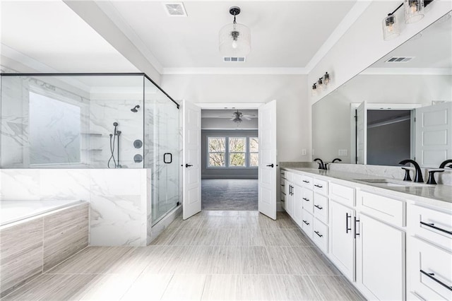 bathroom with separate shower and tub, vanity, and crown molding