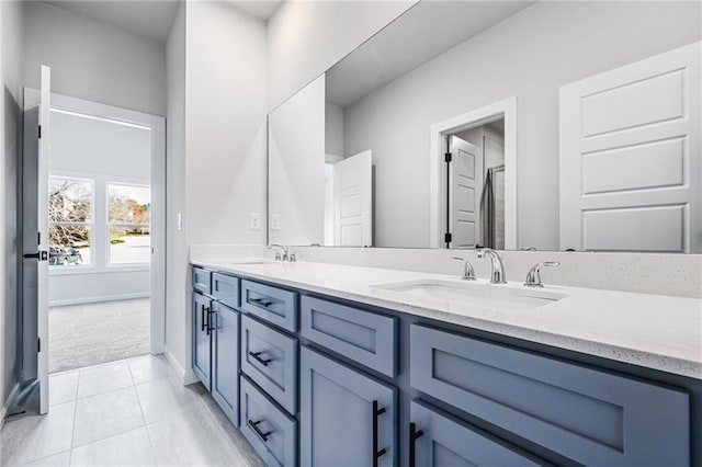 bathroom with vanity and tile patterned flooring