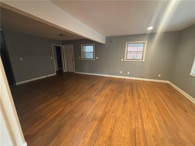 unfurnished room with hardwood / wood-style floors