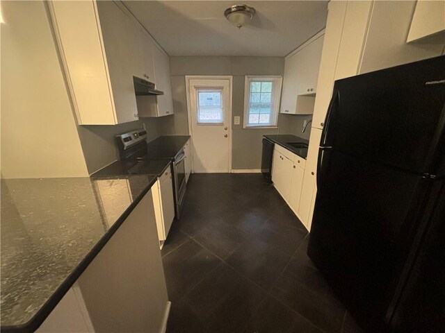 kitchen featuring dark stone counters, sink, white cabinets, and black appliances