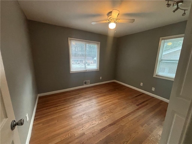 spare room with light hardwood / wood-style floors and ceiling fan