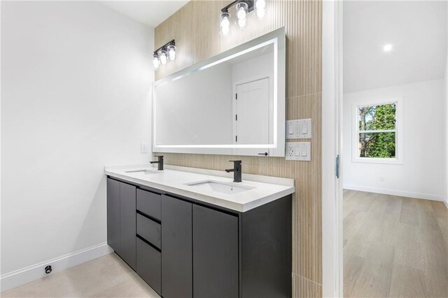 1247 Bridges Ave SW Unit B, Atlanta, GA 30310 - full bathroom with double vanity, baseboards, and wood finished floors