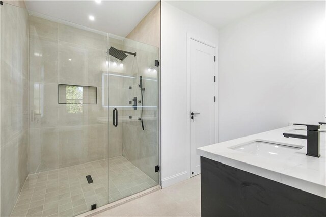 1247 Bridges Ave SW Unit B, Atlanta, GA 30310 - bathroom featuring a stall shower, double vanity, tile patterned floors, and recessed lighting