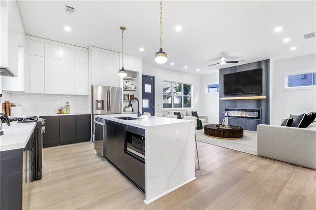 1247 Bridges Ave SW Unit B, Atlanta, GA 30310 - kitchen featuring a sink, modern cabinets, dark cabinets, recessed lighting, and open floor plan