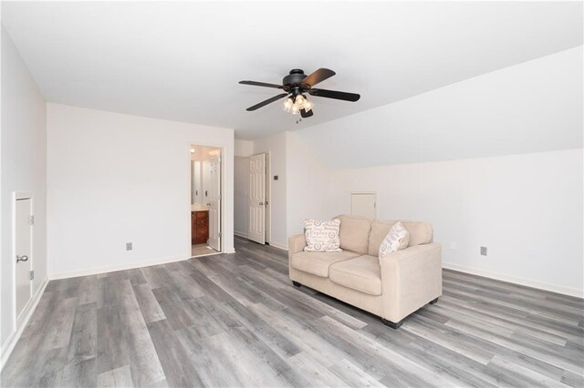 unfurnished room featuring ceiling fan, hardwood / wood-style floors, and vaulted ceiling