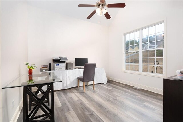 office featuring hardwood / wood-style flooring, vaulted ceiling, and ceiling fan