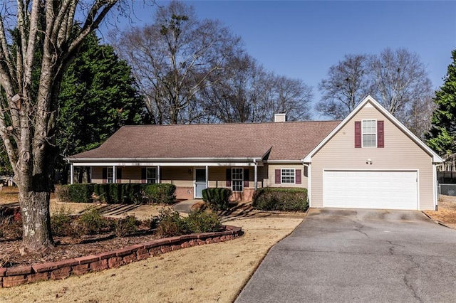 view of front of home with a garage and a porch