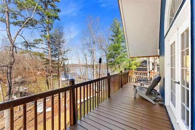 deck featuring a water view and french doors