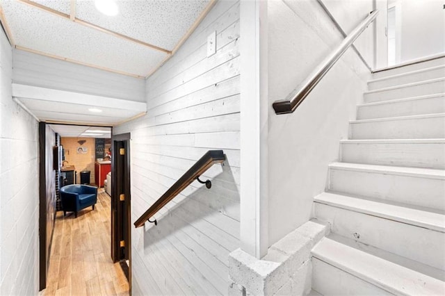 stairs with wood finished floors
