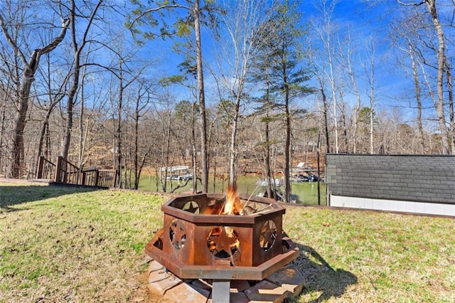 view of yard with an outdoor fire pit