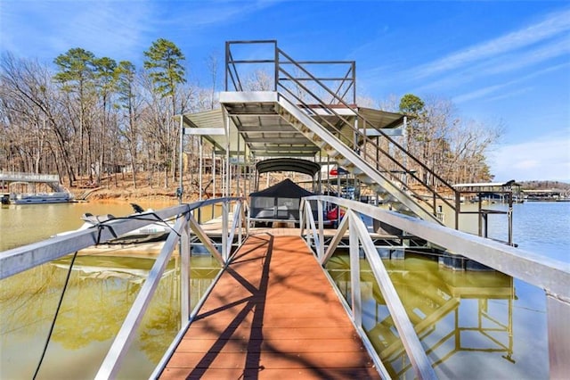 view of dock featuring a water view and boat lift