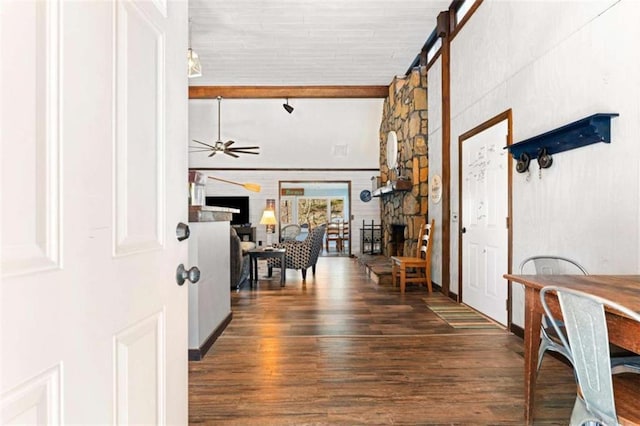 entrance foyer featuring wood finished floors, a ceiling fan, and beam ceiling