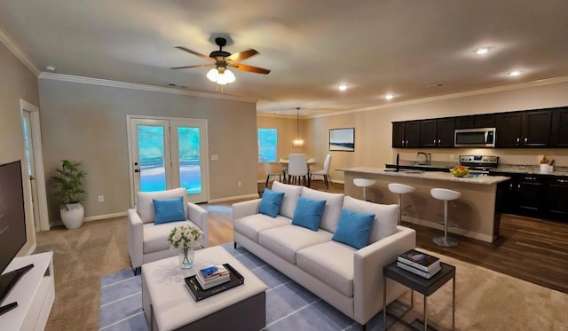 living room featuring crown molding and ceiling fan