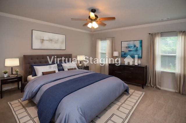 carpeted bedroom with ceiling fan and ornamental molding