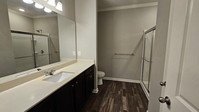 bathroom with an enclosed shower, hardwood / wood-style floors, crown molding, and toilet